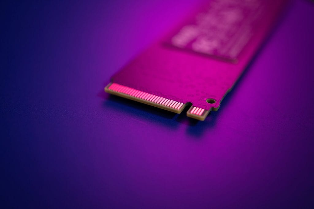 NVMe SSD hard drive with purple background.