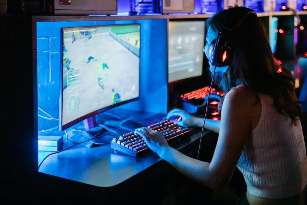 Girl playing PC game online