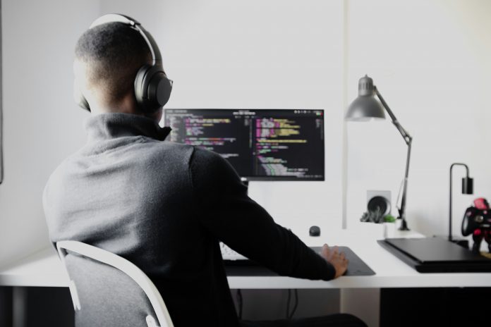 Computer programmer at desk